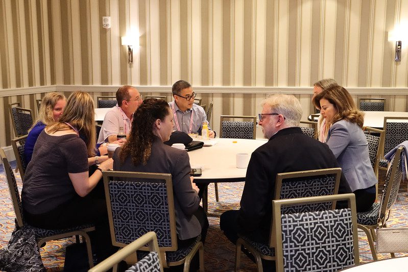 A group sitting at a table in discussion