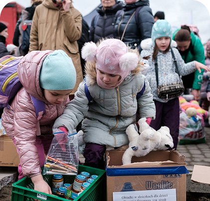 Kids getting supplies from a donation event