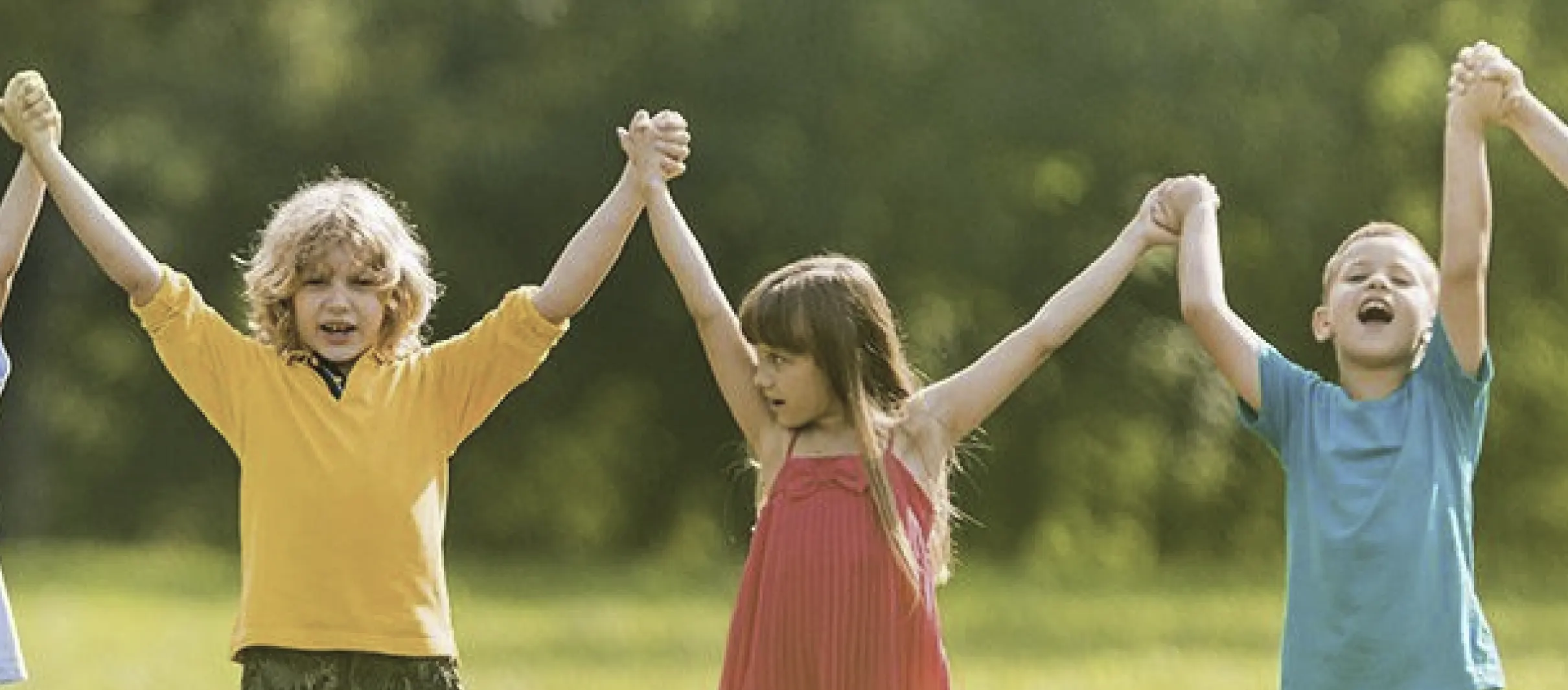 Kids with their hands raised