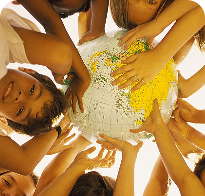 A group of diverse children holding up a globe