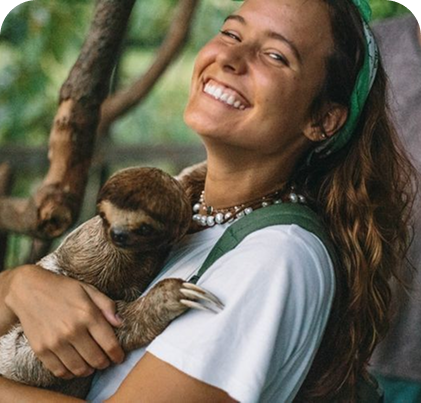 Smiling woman with a sloth