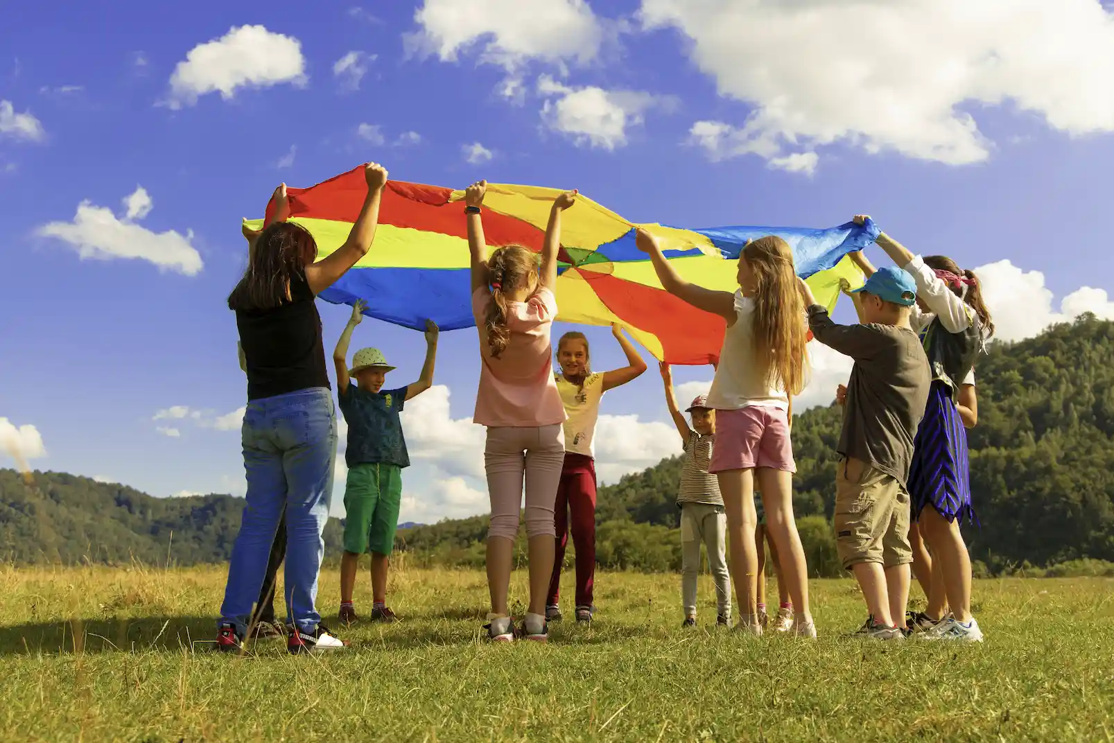 Children playing with a parachute