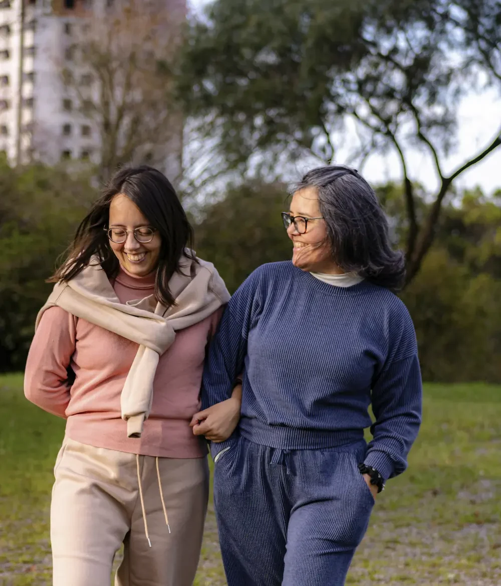 Two older women walking together