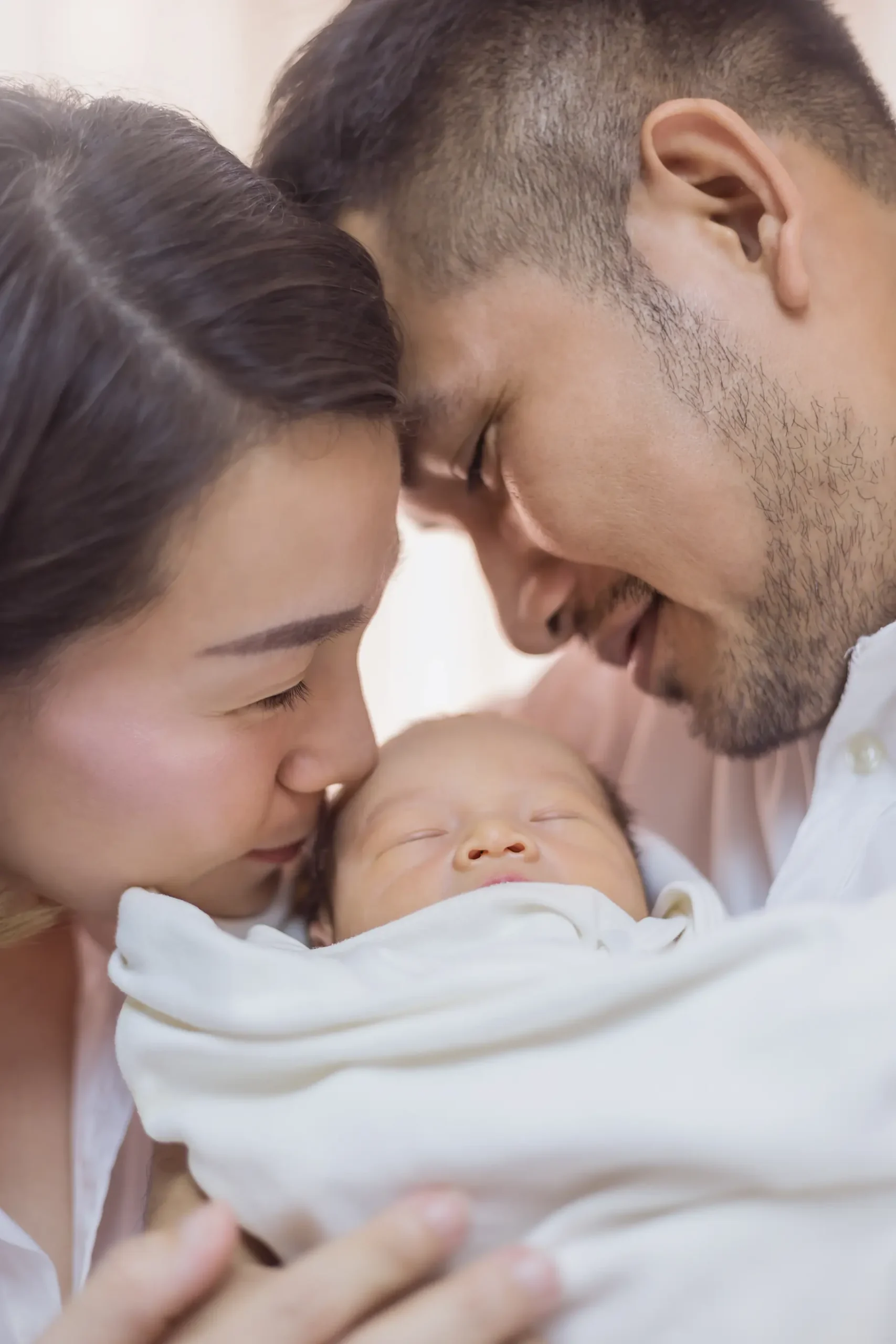 Asian parents with newborn baby
